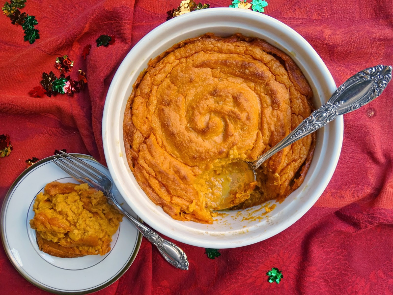 A photo of sweet potato-ginerger souffle in a bowl with a portion on a plate