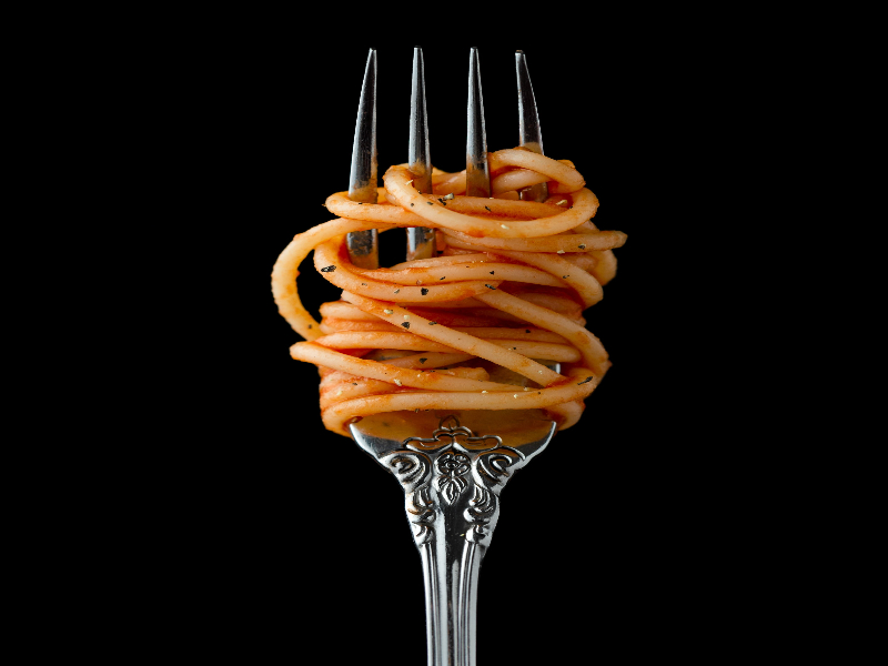 A photo of spaghetti twirled around a fork