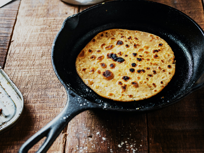 Photo of a cast-iron skillet filled with a piadina